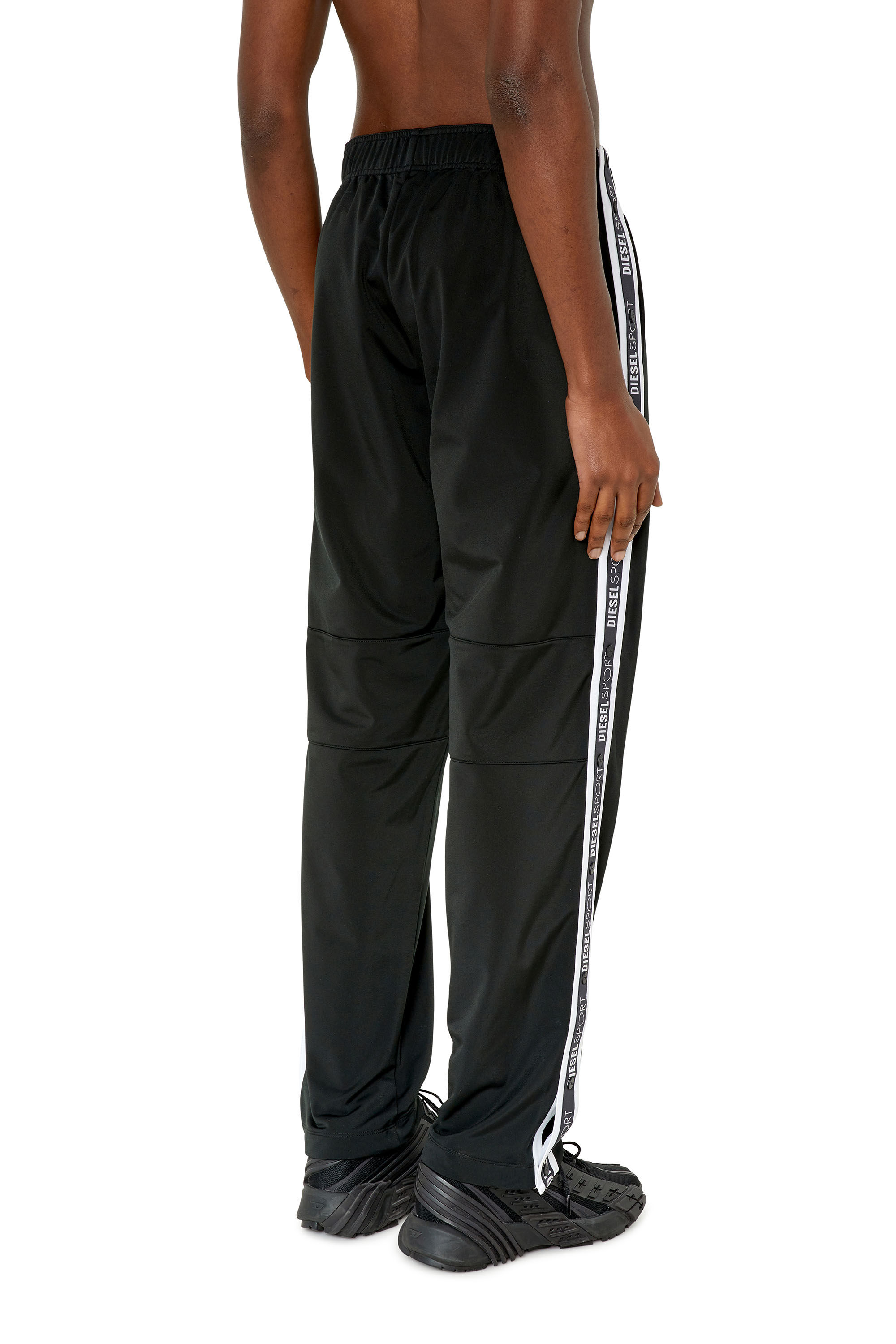 AMSB-HORACE-HT14 Man: Track pants with logo tape openings | Diesel