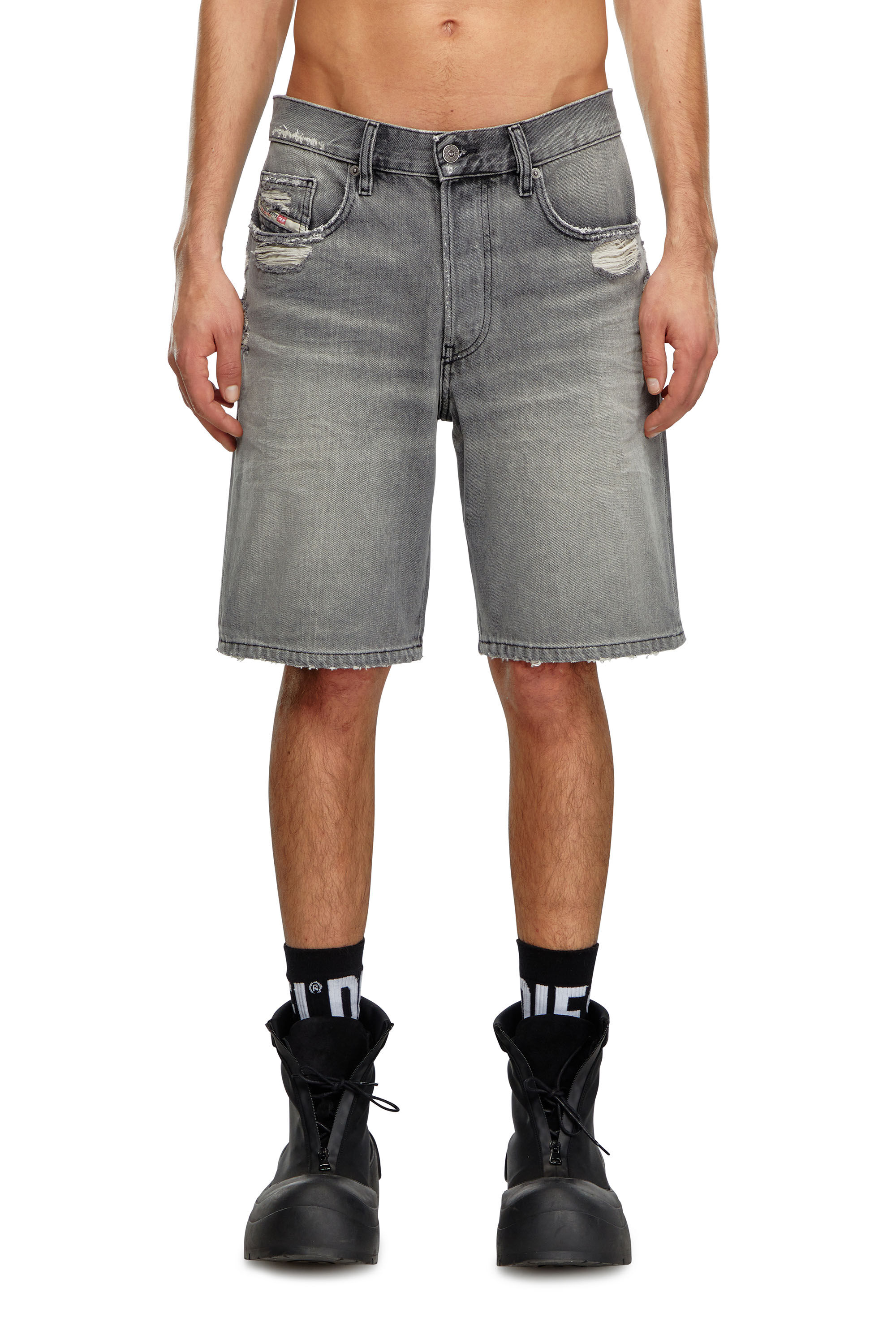 Guy in short denim shorts on sale